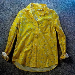 A yellow floral button up shirt.